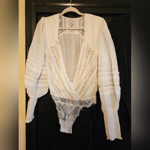 Free people gorgeous lace body suit. Cream and black. Both size M